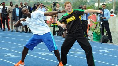 Britain's Prince Harry, right, and Olympic sprint champion Usain Bolt pose for photographers doing Bolt's landmark gesture after a mock race in Kingston, Jamaica, Tuesday March 6, 2012. The Prince is in Jamaica as part of the Diamond Jubilee tour in honor of Queen Elizabeth II who celebrates 60 years on the throne. His visit comes as the new prime minister, Portia Simpson Miller, has called anew for the severing of ties with the British monarchy. (AP Photo/Collin Reid)